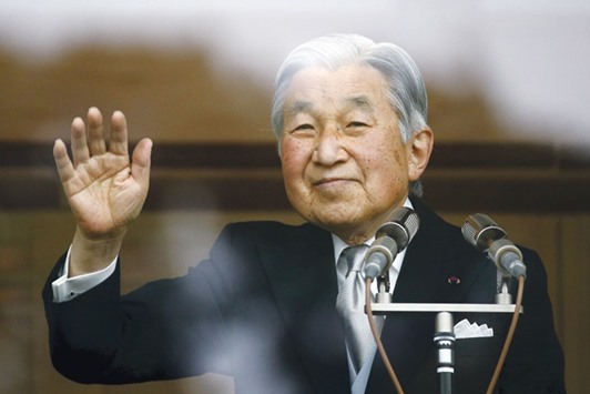 A file photo of Emperor Akihito waving to well-wishers who gathered at the Imperial Palace to mark his 82nd birthday in Tokyo on December 23, 2015.