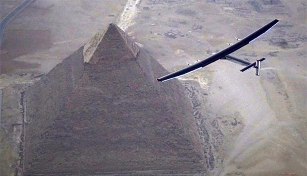 Solar Impulse 2, piloted by Swiss pioneer Andru00e9 Borschberg, is seen during the flyover of the pyramids of Giza on Wednesday prior to landing in Cairo.