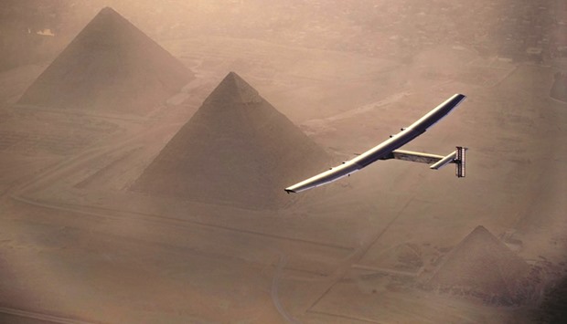 Solar Impulse 2, the solar powered plane, piloted by Swiss pioneer Andre Borschberg, is seen during the flyover of the pyramids of Giza yesterday prior to landing in Cairo.