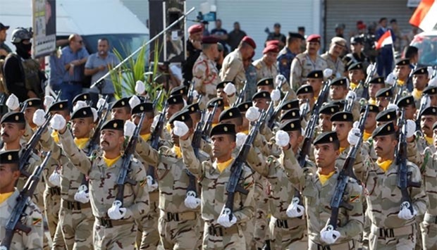 Members of the Iraqi armed forces take part in a military parade at Tahrir Square in central Baghdad on Thursday.