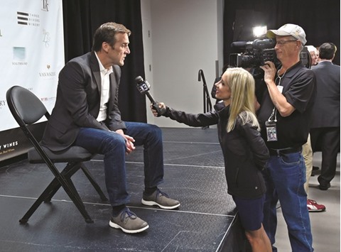 George McPhee (left) is interviewed after being introduced as the general manager of the Las Vegas NHL franchise during a news conference in Las Vegas, Nevada, on Wednesday. (AFP)