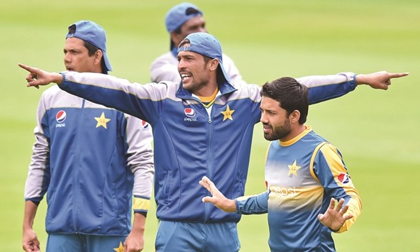 Pakistanu2019s Mohamed Amir (C) gestures during a training session at Lordu2019s cricket ground in London on July 13. Six years ago, during a Lordu2019s Test against England, Amir and Pakistan new-ball partner Mohamed Asif deliberately bowled no-balls on the instructions of captain Salman Butt as part of a sting operation carried out by a tabloid newspaper.