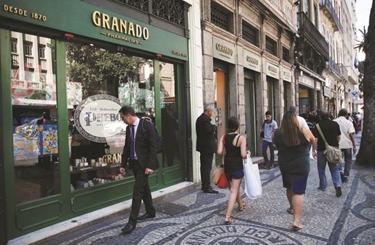 People walk in front of the pharmacy Granado in downtown of Rio de Janeiro. Barcelona-based Puig could pay about 1bn reais ($306mn) for a stake of up to 30% in Granado, sources said yesterday.