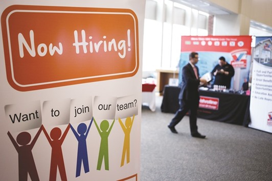 A sign is displayed at a career fair at Papa Johnu2019s Cardinal Stadium in Louisville, Kentucky. Initial claims for state unemployment benefits were unchanged at a seasonally adjusted 254,000 for the week ended July 9, the Labour Department said yesterday.