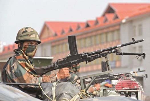A soldier looks on outside the civil secretariat, the seat of power in Jammu and Kashmir, during a meeting of the Unified Headquarters (UHQ) to discuss the ongoing unrest in the state, in Srinagar yesterday. The UHQ, formed in 1993, brings together politicians, civil and military agencies to co-ordinate responses to insurgency-related unrest in the state.
