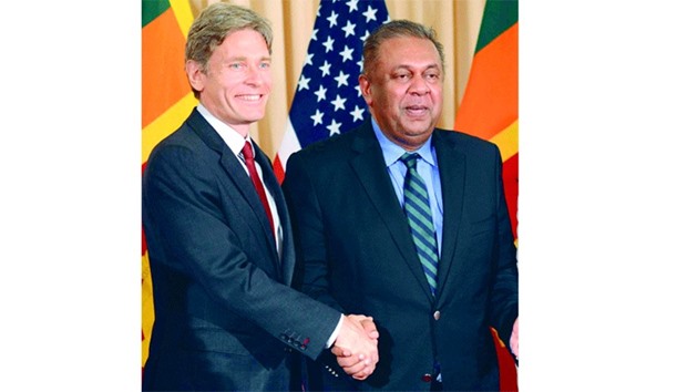 Sri Lankan Foreign Minister Mangala Samaraweera shaking hands with US Assistant Secretary of State for Democracy, Human Rights and Labour Tom Malinowski after a meeting in Colombo.