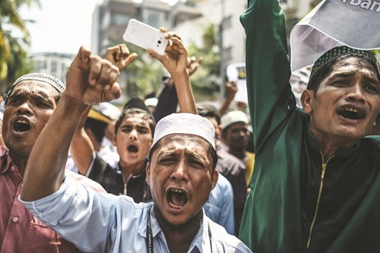 Myanmar ethnic Rohingya Muslim people living in Malaysia shout slogans during a protest against the persecution of the members of their community in Myanmar, outside the Myanmar embassy in Kuala Lumpur yesterday.
