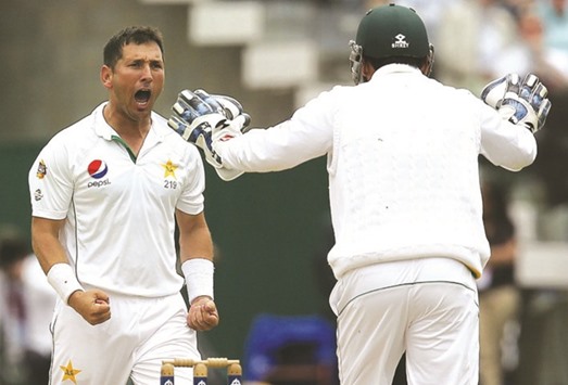 Pakistanu2019s Yasir Shah celebrates taking the wicket of Englandu2019s James Vince for 16 runs on the second day of the first Test cricket match at Lordu2019s yesterday.