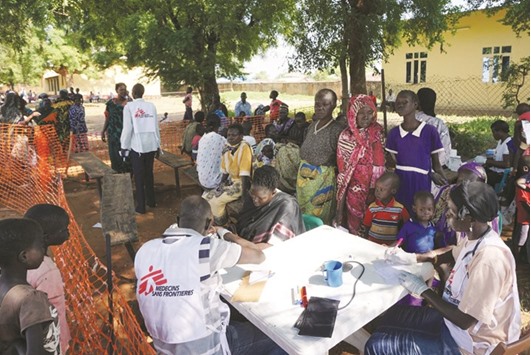 Medics from Doctors Without Borders (MSF) treating patients at a makeshift clinic in the South Sudanese capital Juba yesterday.