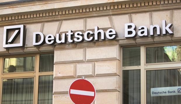 Deutsche Bank signage on the facade of a branch in Hamburg, Germany. Clients of the banku2019s wealth unit prefer dollar bonds as they want to avoid the risk of holding local-currency debt, according to Tuan Huynh, its regional head of portfolio management for Asia Pacific.