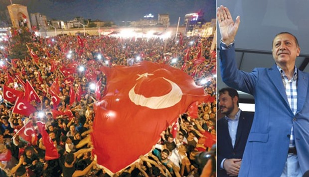 Supporters of President  Erdogan waving national flags as they gather at Taksim Square in central Istanbul yesterday. President Erdogan delivering a speech to his supporters in Istanbul yesterday.