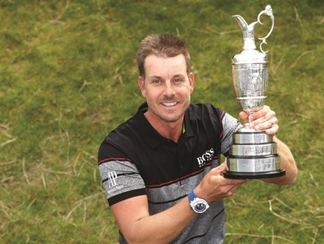 Swedenu2019s Henrik Stenson celebrates with the Claret Jug after winning the British Open golf championship Royal Troon, Scotland, yesterday.