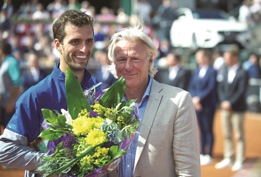 Albert Ramos-Vinolas (left) of Spain poses with legendary Bjorn Borg of Sweden after his triumph at the Swedish Open in Bastad, Sweden yesterday. (AP)