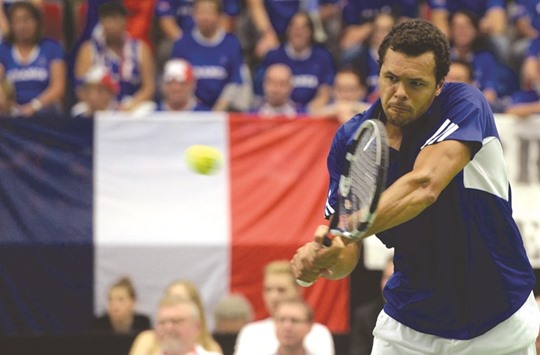 Jo-Wilfried Tsonga of France returns the ball en route to his win over Jiri Vesely of Czech Republic during the Davis Cup quarter-final match in Trinec, Czech Republic yesterday. (AFP)
