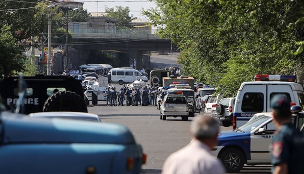Armenian police officers block off the streets leading to Erebuni police station in Yerevan.