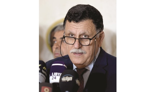 Libyan Prime Minister Fayez al-Sarraj speaks during a press conference in Tunis.