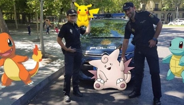 Spanish police pose with Pokemon Go figures in this handout picture provided by the Spanish Interior Ministry on Monday.