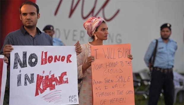 Pakistani activists carry placards during a protest in Islamabad this week.