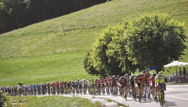 The pack rides during the 209km 16th stage of the 103rd edition of the Tour de France cycling race between Moirans-en-Montagne and Berne in Switzerland yesterday.