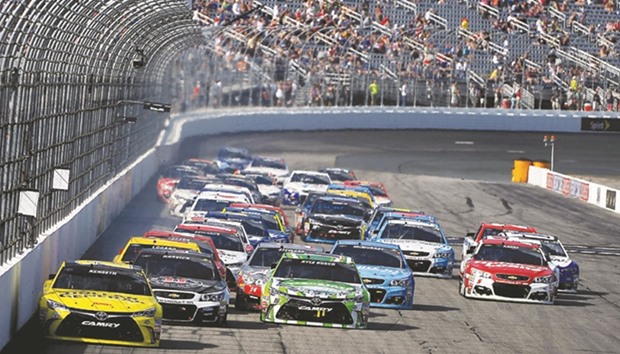 Matt Kenseth (left), of the Dollar General Toyota team, leads the field during the NASCAR Sprint Cup Series New Hampshire 301 at  New Hampshire Motor Speedway in Loudon, New Hampshire on Sunday.