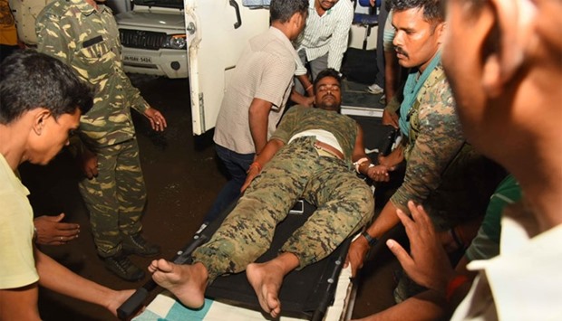 An injured Indian paramilitary personnel is brought to hospital following an attack on a convoy of paramilitary commandos in Gaya, some 150 kms southwest of Patna in the northern Indian state of Bihar