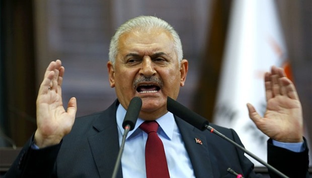 Turkey's Prime Minister Binali Yildrim addresses members of parliament from his ruling AK Party (AKP) during a meeting at the Turkish parliament in Ankara, Turkey