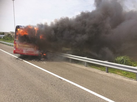 This handout photo taken and released by the Taoyuan City Fire Department yesterday shows the bus on fire after it crashed along an expressway on its way to the airport.