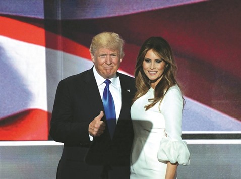 Donald Trump on stage with his wife Melania following her address to delegates.