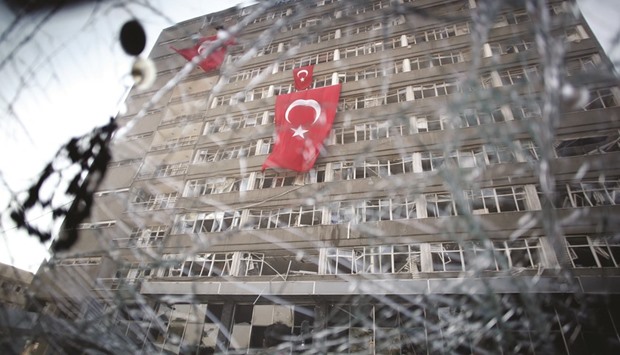 The Ankara police headquarters is seen through a caru2019s broken window, which was caused by fighting during the coup attempt.