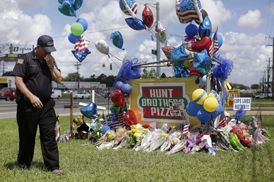 A makeshift memorial for the three police officers, who were shot dead an ex-US Marine, in Baton Rouge, Louisiana.