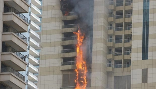 Flames are seen after a fire broke out at residential Sulafa Tower in Marina district in Dubai on Wednesday.