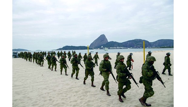 Brazilian marines disembark on Flamengo Beach, near the site that will host the sailing competitions for 2016 Olympic Games, during a drill  in Rio de Janeiro. (AFP)