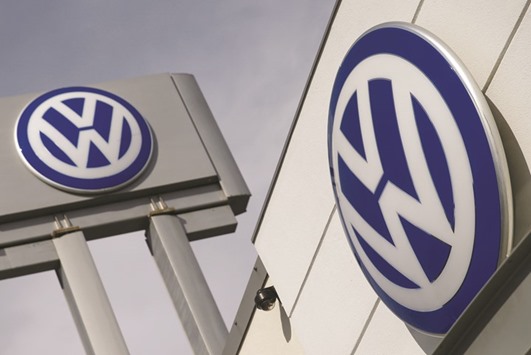 The logos of Volkswagen is seen at a dealership in New York. Shares in the German carmaker soared around 6% yesterday.