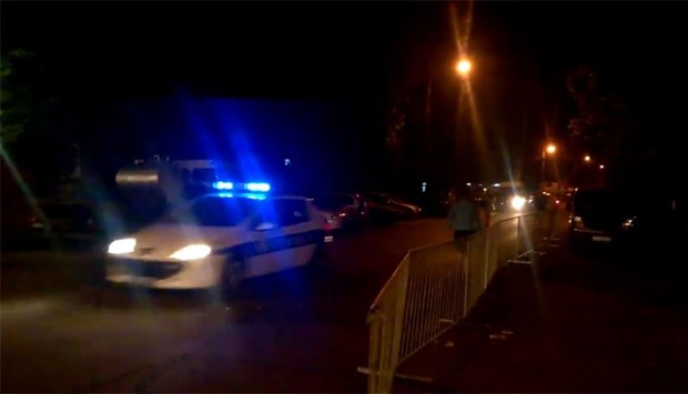 Police vehicles outside the cafe.
