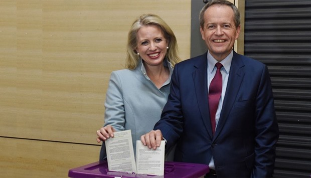 Australian Labor Party opposition leader Bill Shorten and wife Chloe cast their ballots at a polling station at Moonee Ponds West Primary School in Melbourne.