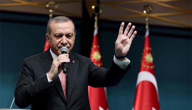 Turkish President Recep Tayyip Erdogan addresses the nation in a live television broadcast from the presidential palace in Ankara.