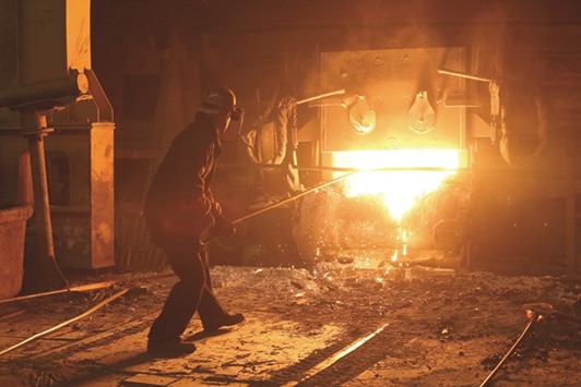 A worker cleans slag from an electric arc furnace in the steel making shop at the Izhstal steel plant, operated by Mechel, in Izhevsk, Russia. Mechel agreed to a restructuring with Sberbank in April after deals with VTB Bank and Gazprombank last year, bringing total restructured debt to $4bn. Lenders including ING Bank and Societe Generale hold $1bn of debt through a pre-export loan, which gained a waiver in 2013.