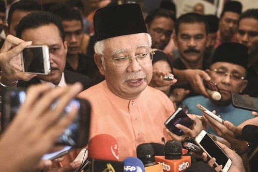 Malaysiau2019s Prime Minister Najib Razak speaks to members of the media after an event in Kuala Lumpur yesterday. The US Justice Department lawsuits filed in a federal court on Wednesday did not name Najib, instead referring to u2018Malaysian Official 1.u2019