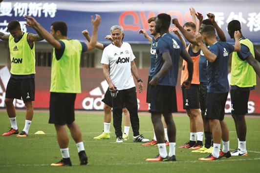 Manchester United coach Jose Mourinho keeps a close eye as his players train on the eve of the International Champions Cup match against Borussia Dortmund in Shanghai yesterday. (Reuters)