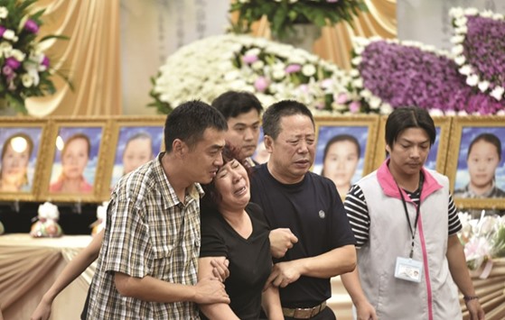 Chinese relatives mourn the loss of victims of a bus crash at Chungli funeral parlour in Taoyuan, northern Taiwan.