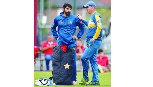 Pakistan captain Misbah-ul-haq (L) talks with team coach Mickey Arthur during a practice session at Old Trafford Cricket Ground in Manchester yesterday.
