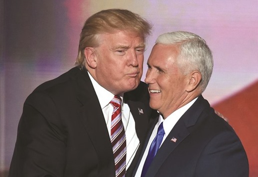 US Republican presidential candidate Donald Trump greets vice presidential candidate Mike Pence after his speech on day three of the Republican National Convention at the Quicken Loans Arena in Cleveland, Ohio, on Wednesday.