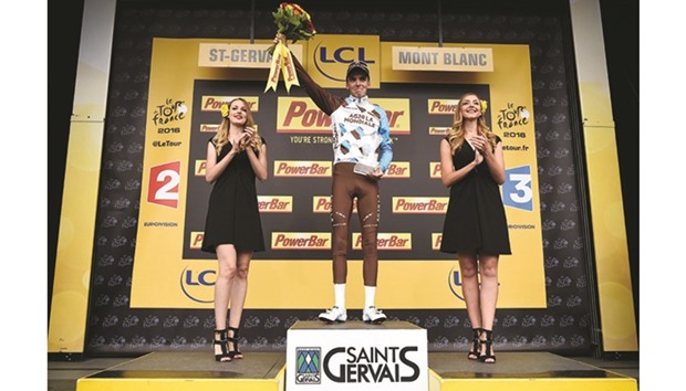 Franceu2019s Romain Bardet celebrates on the podium after winning the Tour de France 19th stage yesterday. (AFP)