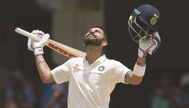 India captain Virat Kohli celebrates scoring 200 runs during day two of the first Test match against the West Indies at Sir Vivian Richards Stadium at North Sound, Antigua and Barbuda, yesterday.