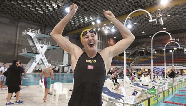 Cate Campbell celebrating after breaking the womenu2019s 100 metres freestyle world record in Brisbane yesterday.