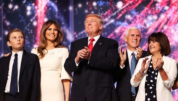 Barron Trump, Melania Trump, Republican presidential candidate Donald Trump, Republican vice presidential candidate Mike Pence and Karen Pence acknowledge the crowd at the end of the the Republican National Convention on July 21, 2016 at the Quicken Loans Arena in Cleveland, Ohio.