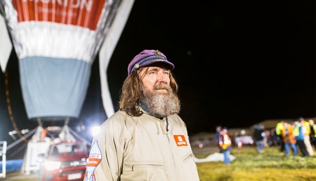 Russian adventurer Fedor Konyukhov is seen in front of his balloon as it is inflated before the start of his record attempt for a solo hot-air balloon flight around the globe near Perth, Australia, on  July 12, 2016.
