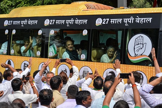 Congress chief ministerial candidate Sheila Dikshit waves from inside a bus during the flag-off of the three-day u2018bus yatrau2019 in the run-up to the 2017 Uttar Pradesh assembly elections, in New Delhi yesterday.