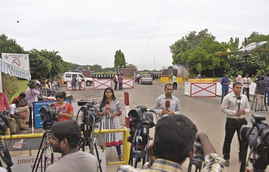 Members of the media gather outside Tambaram Air Force station in Chennai yesterday for information about the missing plane.