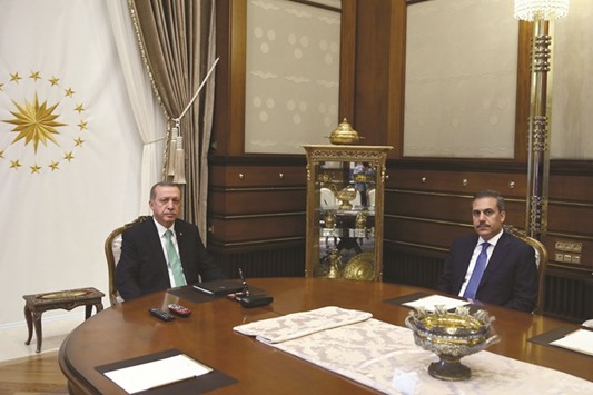 A handout picture taken and released on Friday shows Erdogan with Fidan at the Presidential Complex, in Ankara.
